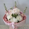 Soft pinks, creamy whites, and a whisper of lavender come together in