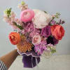 A romantic Mother&rsquo;s Day bouquet designed with lush peonies, premium ranunculus, lavender