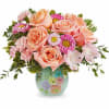 The Watercolor Garden Bouquet features peach roses, pink alstroemeria, miniature pink carnations