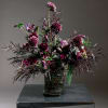 ALL DESIGNS IN PHOTOS ARE DELUXE +
Moody, romantic, and undeniably modern-this tall