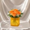 A charming flower arrangement featuring four premium roses, accented with delicate filler