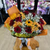 A bouquet that reads like a warm embrace: deep red roses paired