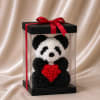 A charming panda handcrafted entirely from delicate foam roses in classic black
