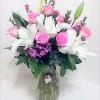 Pink and white mixed bouquet in a glass vase