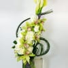 White Callas, Green Cymbidium Orchids, White Roses, Flexi Grass.

Approximately 30" H by