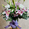Soft, graceful, and effortlessly sophisticated, Lily Elegance is a stunning arrangement designed