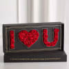 Black display box with red roses arranged as I love you