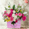 A Charming Mother's Day designers choice arrangement bursting with fresh blooms beautifully