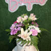Fresh flowers on a white box. Color and flower substitution might apply