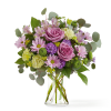 An opulent design featuring the eye catching contrast of soft lavender blooms