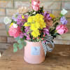 Sweet, soft, and full of charm. This arrangement leans into delicate tones