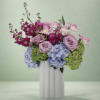 Fresh hydrangeas, roses, and stock come together in the perfect celebratory surprise.