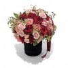 Bouquet of red and pink roses in a black hatbox