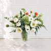 A soft, garden-style composition with poppies leading the way, designed with airy