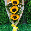 3 sunflowers wrapped in paper