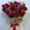 A stunning bouquet featuring 25 premium red roses beautifully arranged with fresh