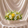 A fresh and uplifting flower arrangement featuring a soft yellow rose as