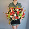 The name reflects the vibrant mix of warm oranges, soft peaches, and