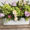 An oblong, low centerpiece perfect for a table centerpiece. Approx. 14" long.