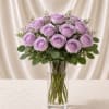 A timeless flower arrangement of twelve beautiful lavender roses, thoughtfully designed in