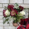 Bouquet of burgundy and white flowers with greenery