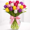 A lush and elegant tulip arrangement featuring a vibrant mix of pink