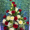 Tall bouquet of red and white roses with lilies and daisies