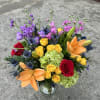 Playful and eye-catching, this arrangement mixes vivid hues and unique textures for