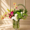 Elegant modern arrangement featuring orchids, roses, hydrangea, chrysanthemums, and premium seasonal blooms