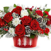Red roses and white flowers in a red holiday container