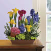 The fun potted flower arrangement is a wonderful way to welcome a