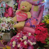 Roses, lilies, carnations, and alstroemeria in pinks, purples, red, and white a