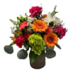 Mixed bouquet in a brown vase with orange gerberas and pink carnations