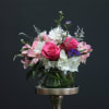 An airy free flowing arrangement full of spring color and life! 