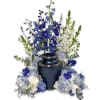 Blue and white floral urn arrangement with tall delphinium and hydrangea clusters