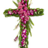Cross-shaped floral arrangement with pink roses and purple orchids