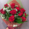 12 red roses wrapped in a hand-hold bouquet with babies' breathe and