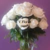 White rose bouquet in a clear glass vase