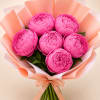 Bright, lush pink peonies form a tightly clustered, hand-tied bouquet that reads