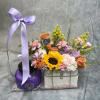 Flower gift set with sunflowers, roses, and carnations in a clear bag