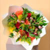 A vibrant medley of orange and red roses, delicate pink blooms, and