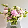 A lovely spring flower arrangement in soft blush pinks and whites. The