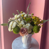 Loose, garden-style mix of white and pale pink roses, green mums and