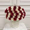 Bouquet of red and white roses in a white hatbox