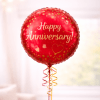 Red anniversary balloon with gold confetti and ribbon curls