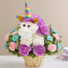 Unicorn-shaped flower basket with rainbow horn and pastel blooms