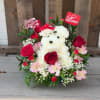 White teddy bear floral arrangement with red roses and pink flowers