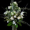 Tall white roses and alstromelia, hypericum, wax flowers create an elegant centerpiece