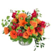 Bursting with Orange! Roses, lilies paired with purple stock and greeneries. 