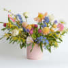 Colorful mixed bouquet in a pink vase